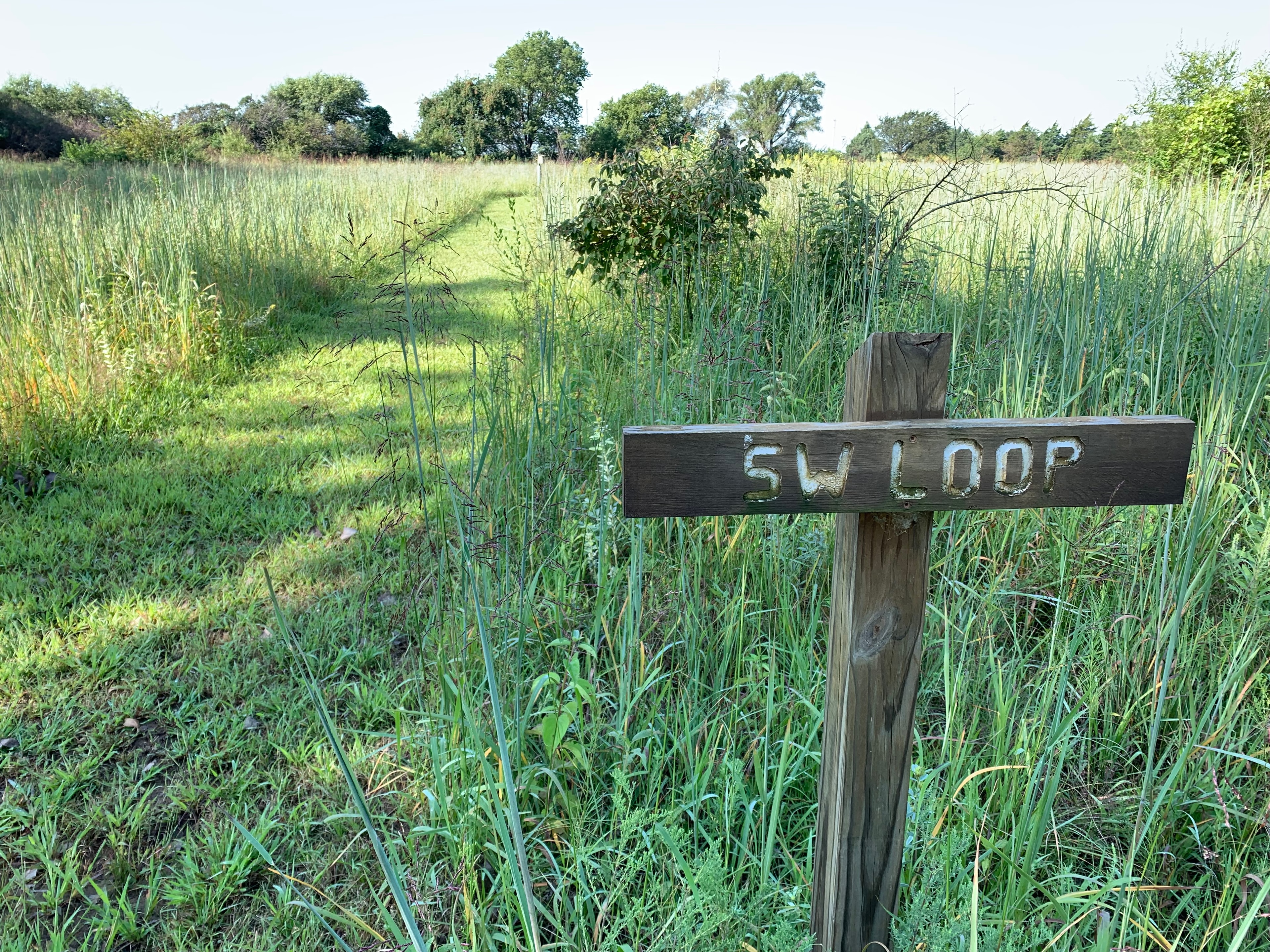 SW Loop trail sign in the prairie